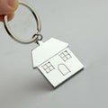 Metal Rotating House Keychain
